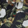 Pantaloni in Denim a zampa larga con motivo floreale e cimosa