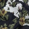 Pantaloni in Denim a zampa larga con motivo floreale e cimosa