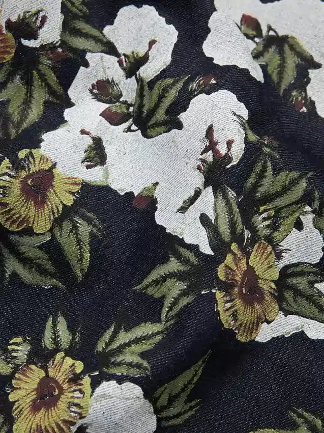Pantaloni in Denim a zampa larga con motivo floreale e cimosa