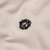 Polo “Peace Wreath” color crema